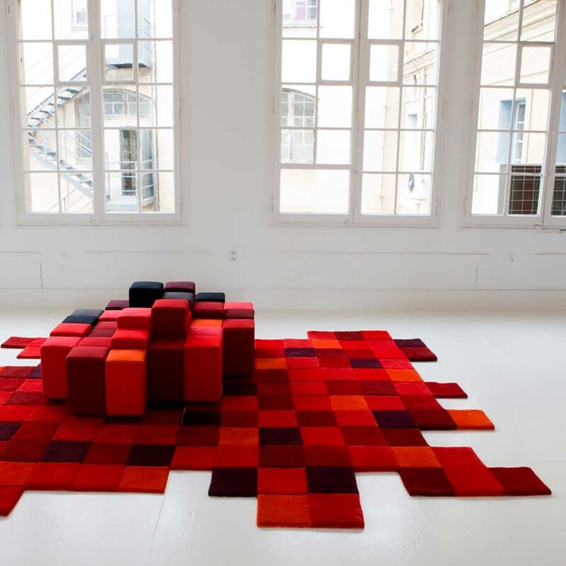 Tapis asymétrique style image pixelisée dans des nuances de rouge